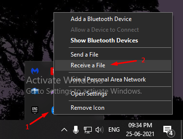 Click on the Bluetooth icon in the notification area and then choose “Receive a file.