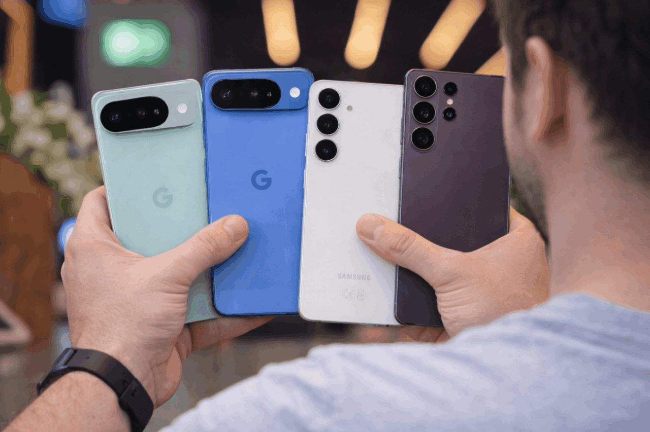 Why I Don't Buy Flagship Android Phones Anymore 1 Holding four smartphones in hand