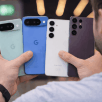 Holding four smartphones in hand