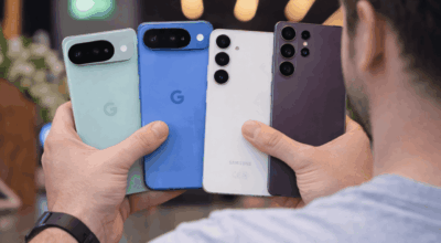 Holding four smartphones in hand