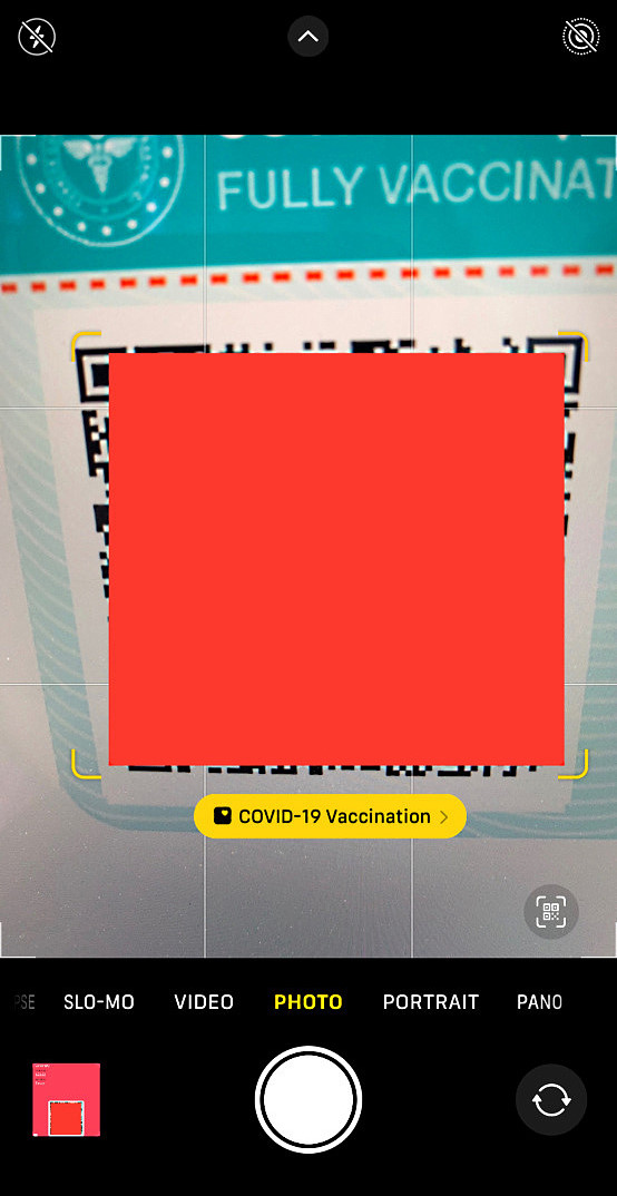 Place the COVID19 immunization card's QR code in front of it.