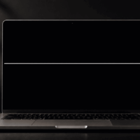 Minimalist laptop with soft lighting with a white line on the Mac screen