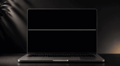 Minimalist laptop with soft lighting with a white line on the Mac screen